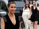 Polar opposites: Kourtney Kardashian keeps it casual in floaty maxi dress while sister Kim flaunts her curves in LBD