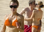 Phil Neville playfully grabs bikini-clad wife Julie's derri�re while stealing a kiss on Barbados holiday 