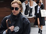Chloe Sevigny dons denim shorts and trench... and readies for NYC rain with burly boots